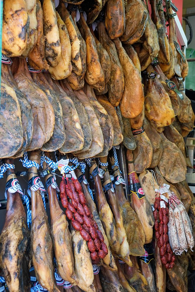 Rhonda, Spain. Legs of Jamon Iberico hanging for sale in local shop.